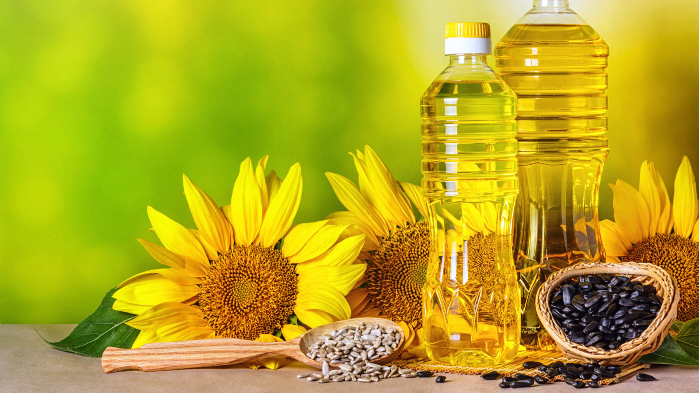 Rural,Still-life,-,Sunflower,Oil,In,Bottles,With,Flowers,Of